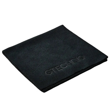 Black towel with 'Gtechniq' branding on a white background