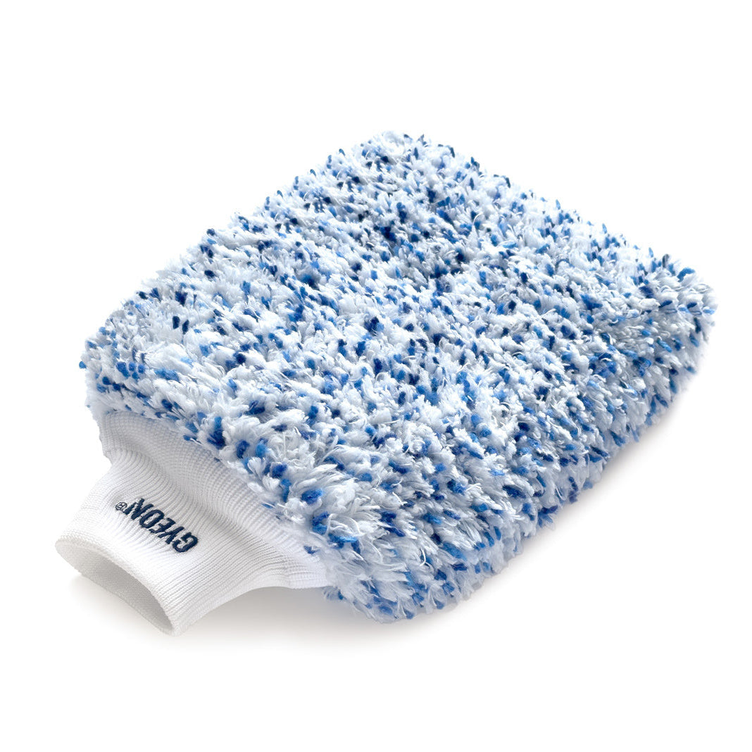 A blue and white microfiber wash mitt with a white elastic cuff, featuring the Gyeon brand logo embroidered on the side.