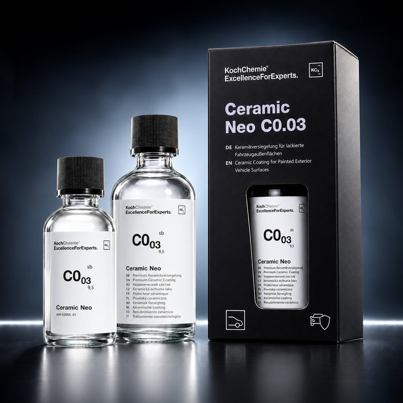 Two clear bottles of KookChemie Ceramics Neo C0.03 with black caps and a black product box, displayed on a dark reflective studio background.