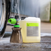 Koch-Chemie PreFoam Efficient alkaline pre-wash cleaner in a plastic container with a foam cannon on a wet surface.
