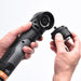 Hand holding a ShineMate EB210 Cordless Polisher with interchangeable attachments on a white background